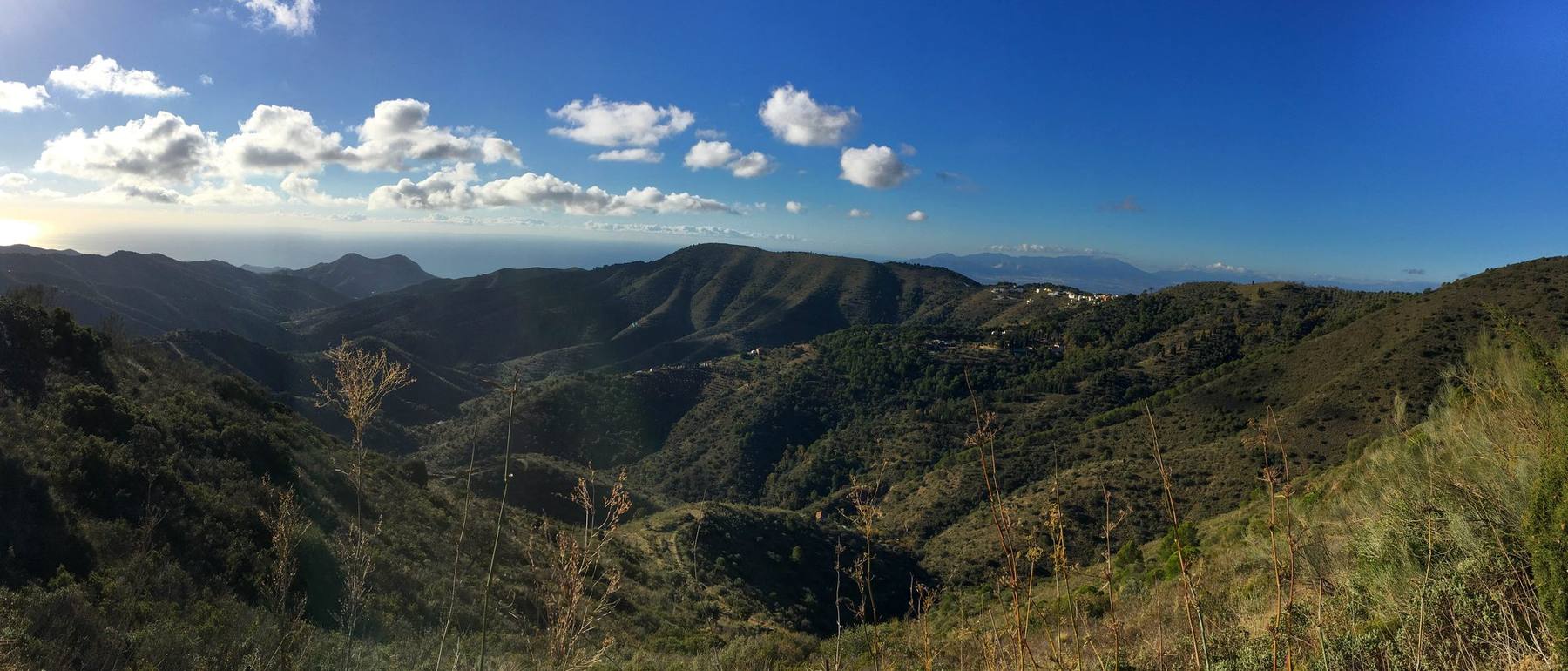 Hills of the Montes de Málaga with the sea visible in the distance